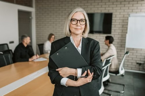 An HR director standing in her office